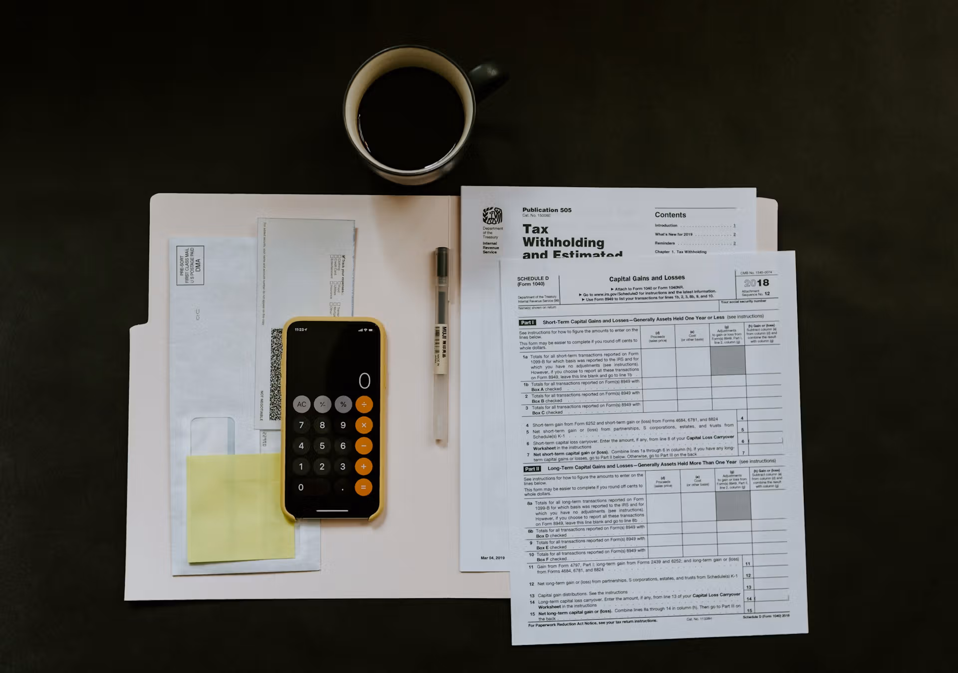 Calculator next to tax documentation (Kelly Sikkema/Unsplash)
