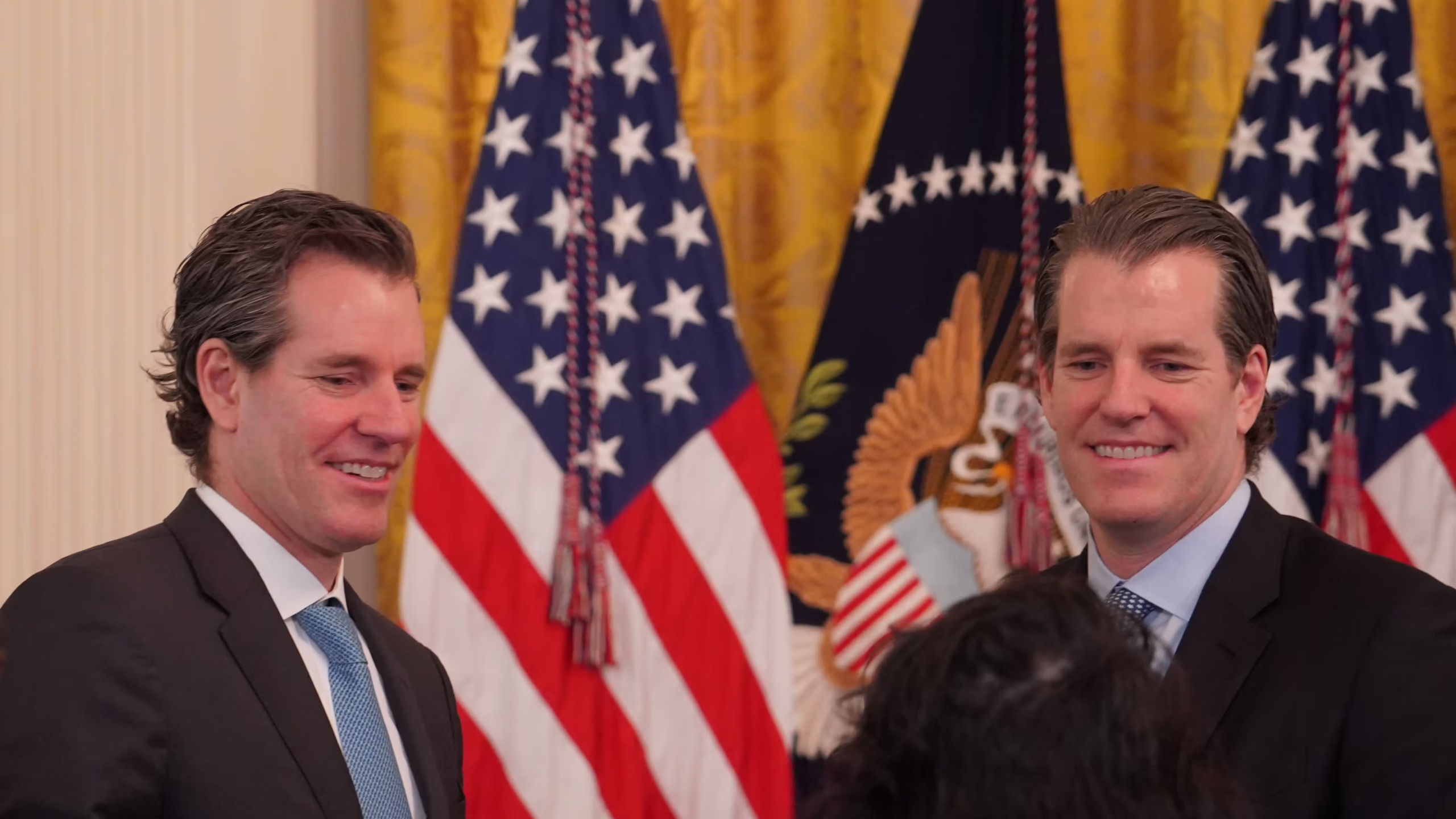 Cameron and Tyler Winklevoss at the White House after last year