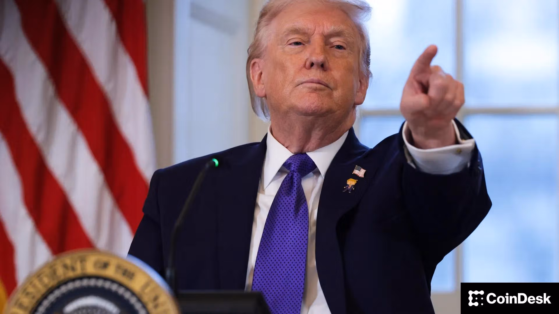 Donald Trump points at the audience during a press conference at the White House.