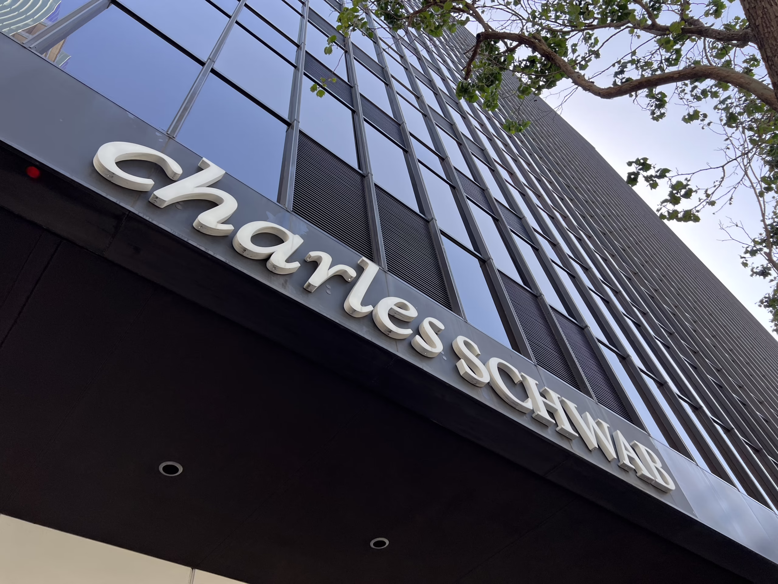 Facade of Charles Schwab office building with visible logo