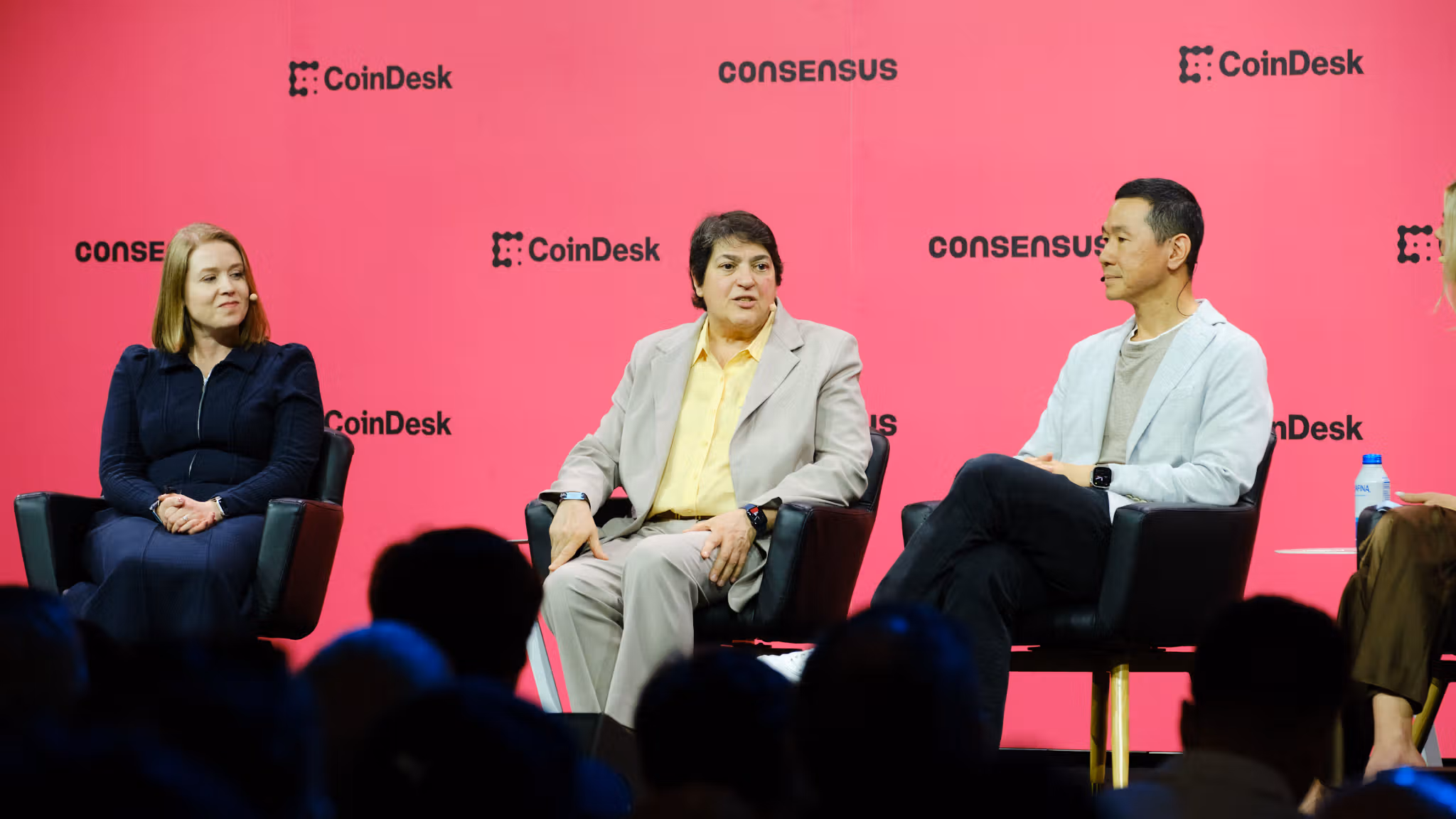 Kara Kennedy, Global Head of Market Development of J.P. Morgan (left), Nadine Chakar, Global Head of Digital Assets of DTCC (center) and Evan Auyang, Group President of Animoca Brands speak at Consensus 2026 in Miami (CoinDesk)